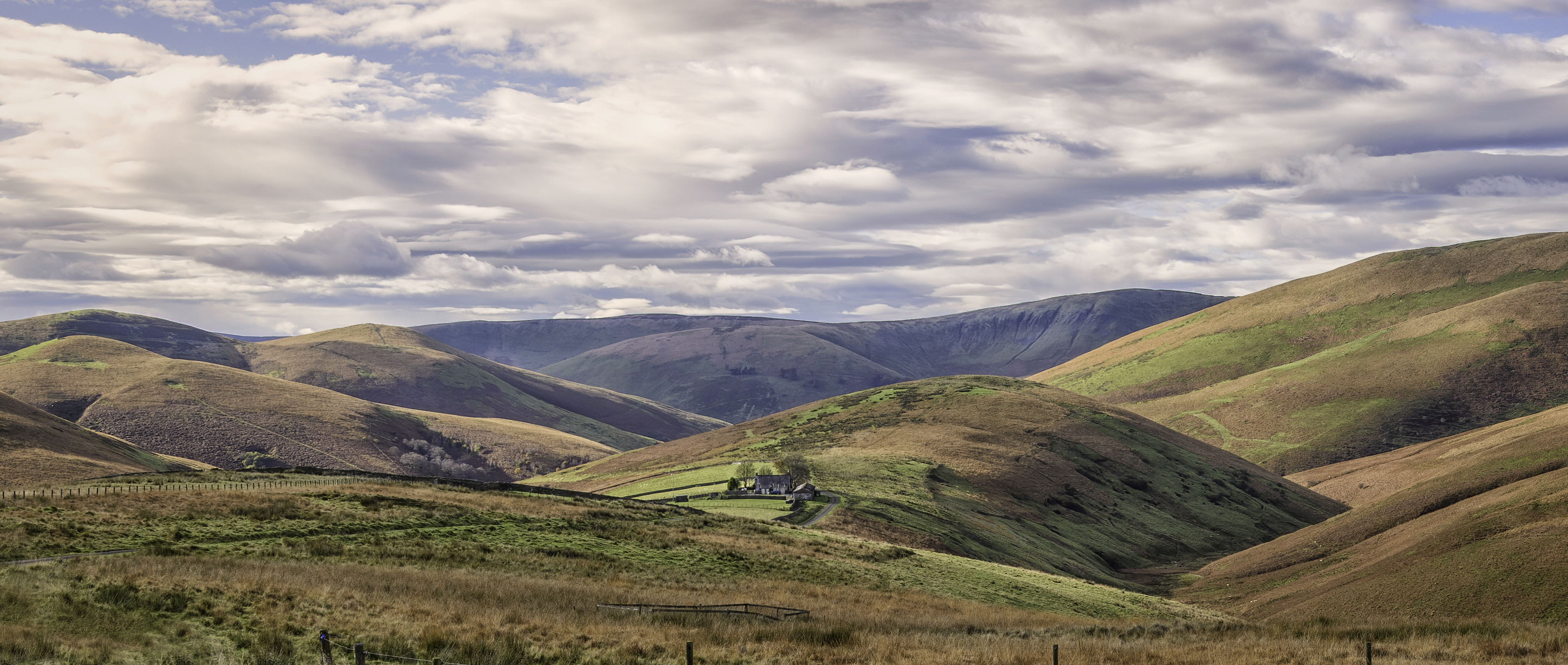 Scenic countryside landscape of Dumfries and Galloway, Scotland, where the council's Community Empowerment Service uses SROI methodology to evidence the social value of Community Asset Transfers